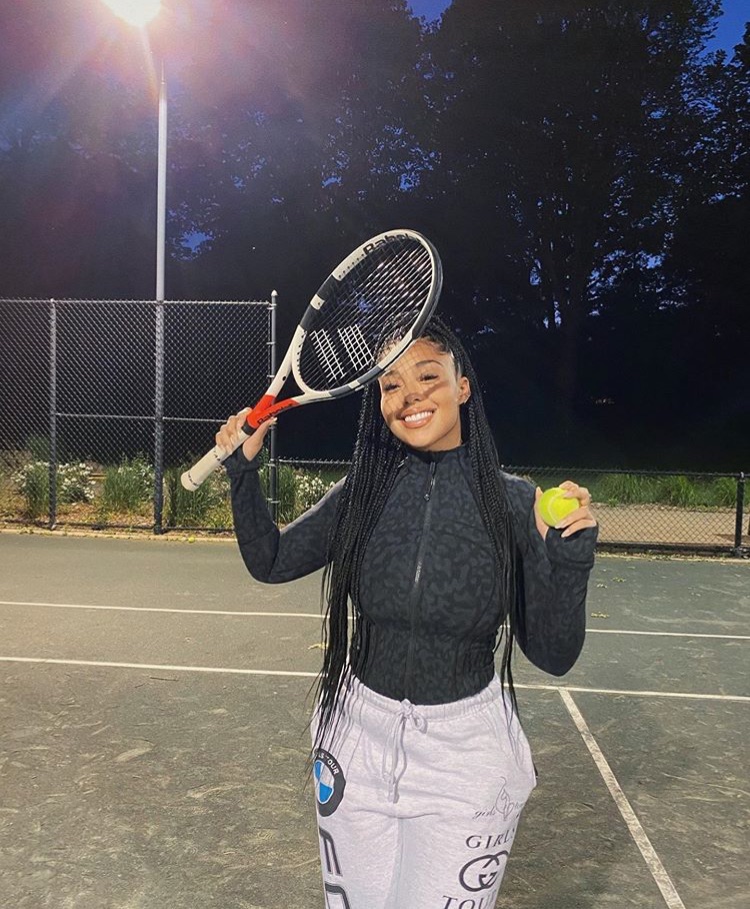 Playing tennis smiling