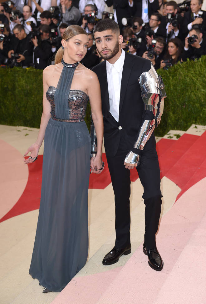 Gigi with zayn at red carpet wearing metal outfits