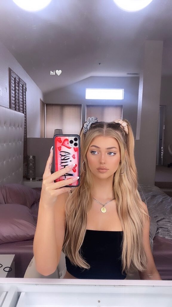 Loren gray with her iphone