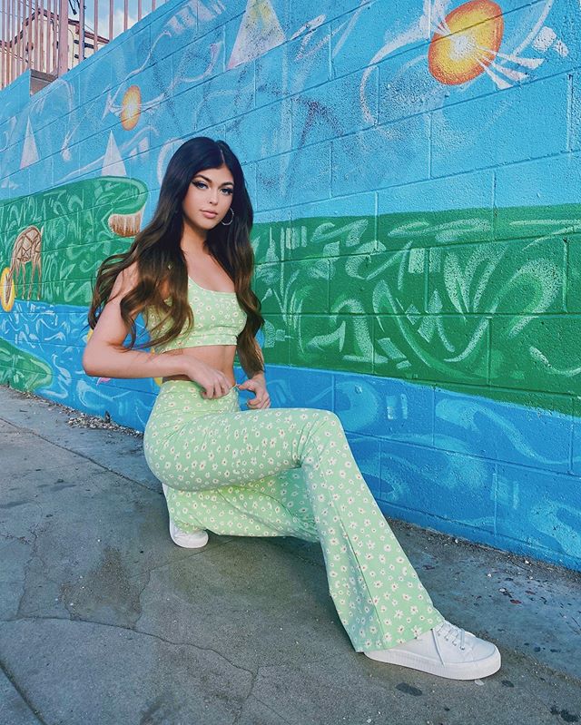 With black hair dyed light green pants